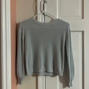 I am selling a baby blue knitted sweater from the brand copper key!